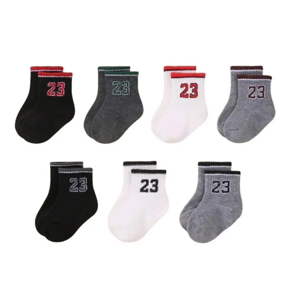 7 Pairs of Baby Solid Color '23' Socks in Multi, Size 0-6M​​